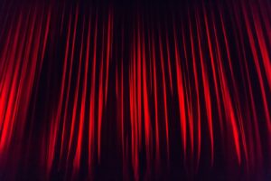 Red drapes inside of theatre